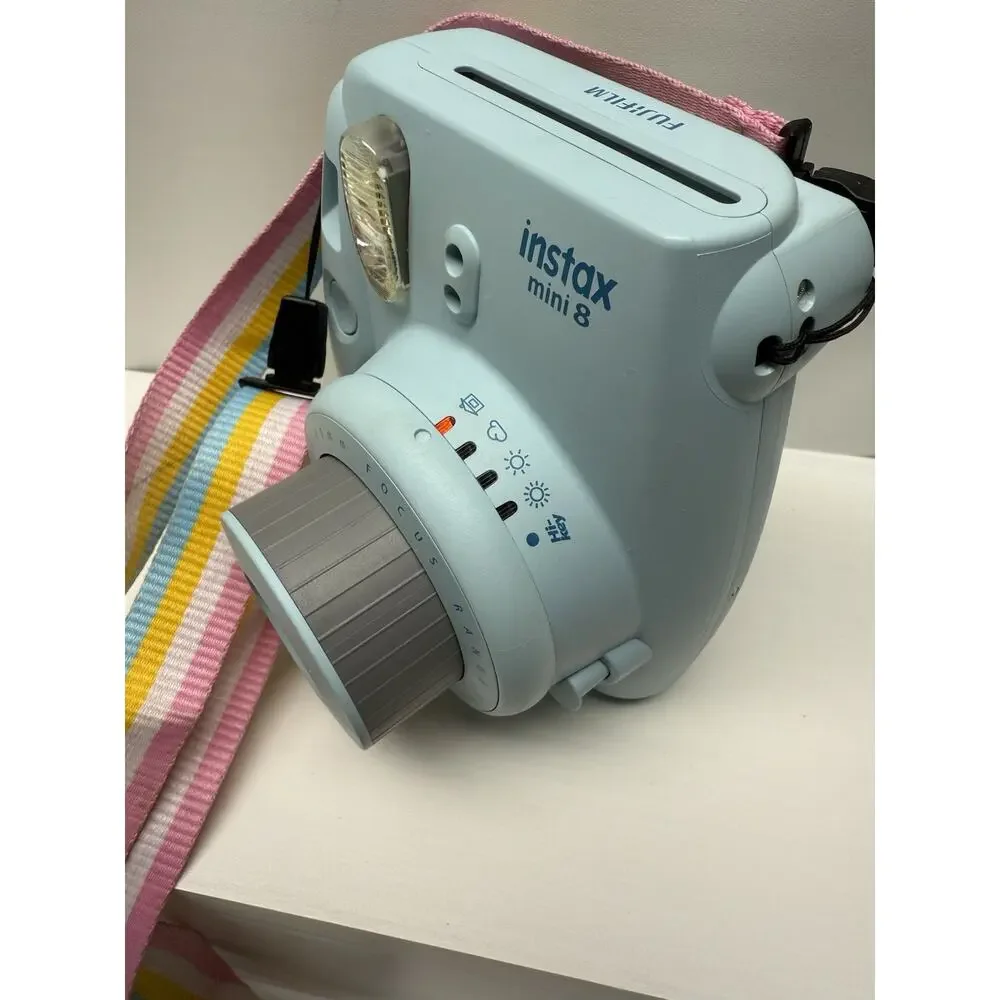 Fujifilm Instax Mini Instant Camera with Light Blue Case and Pastel Strap